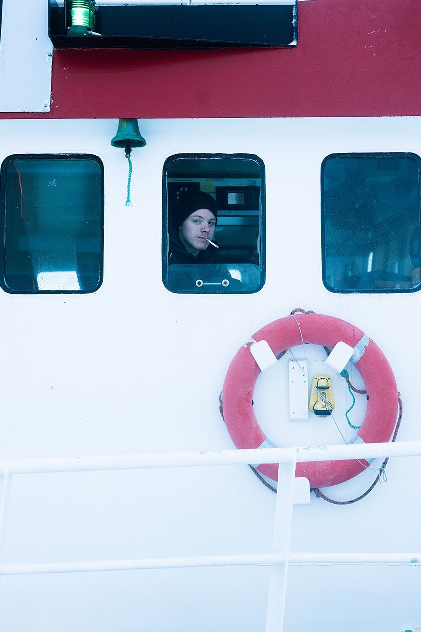 Fisherman in steeringhouse